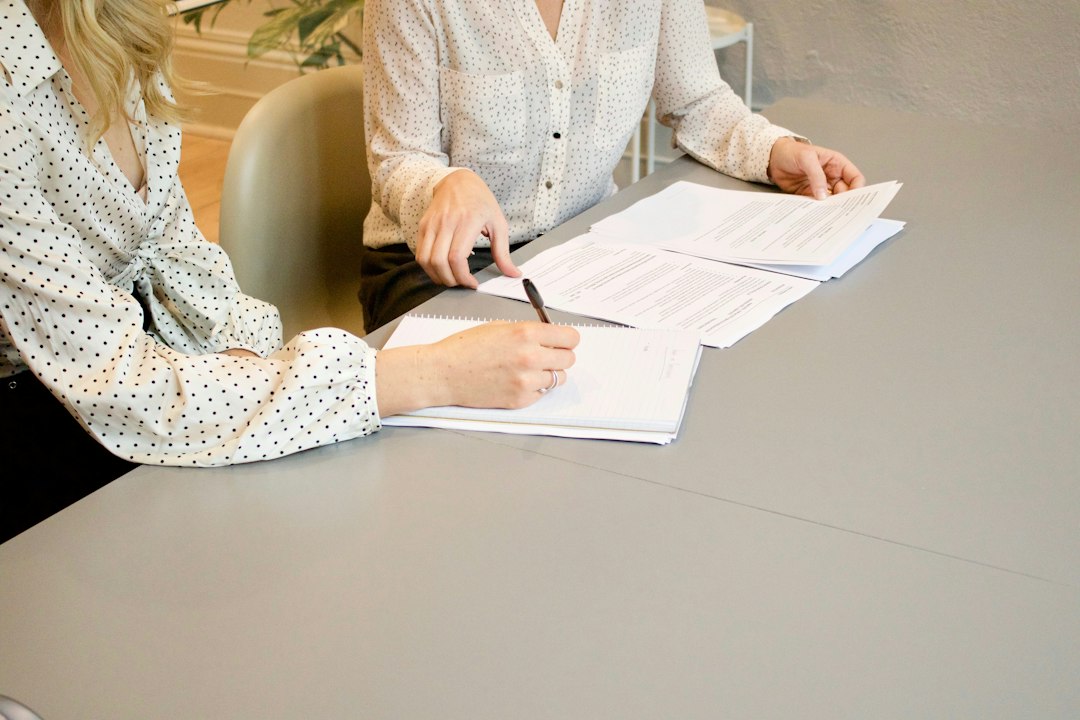 Business professionals reviewing contract documents